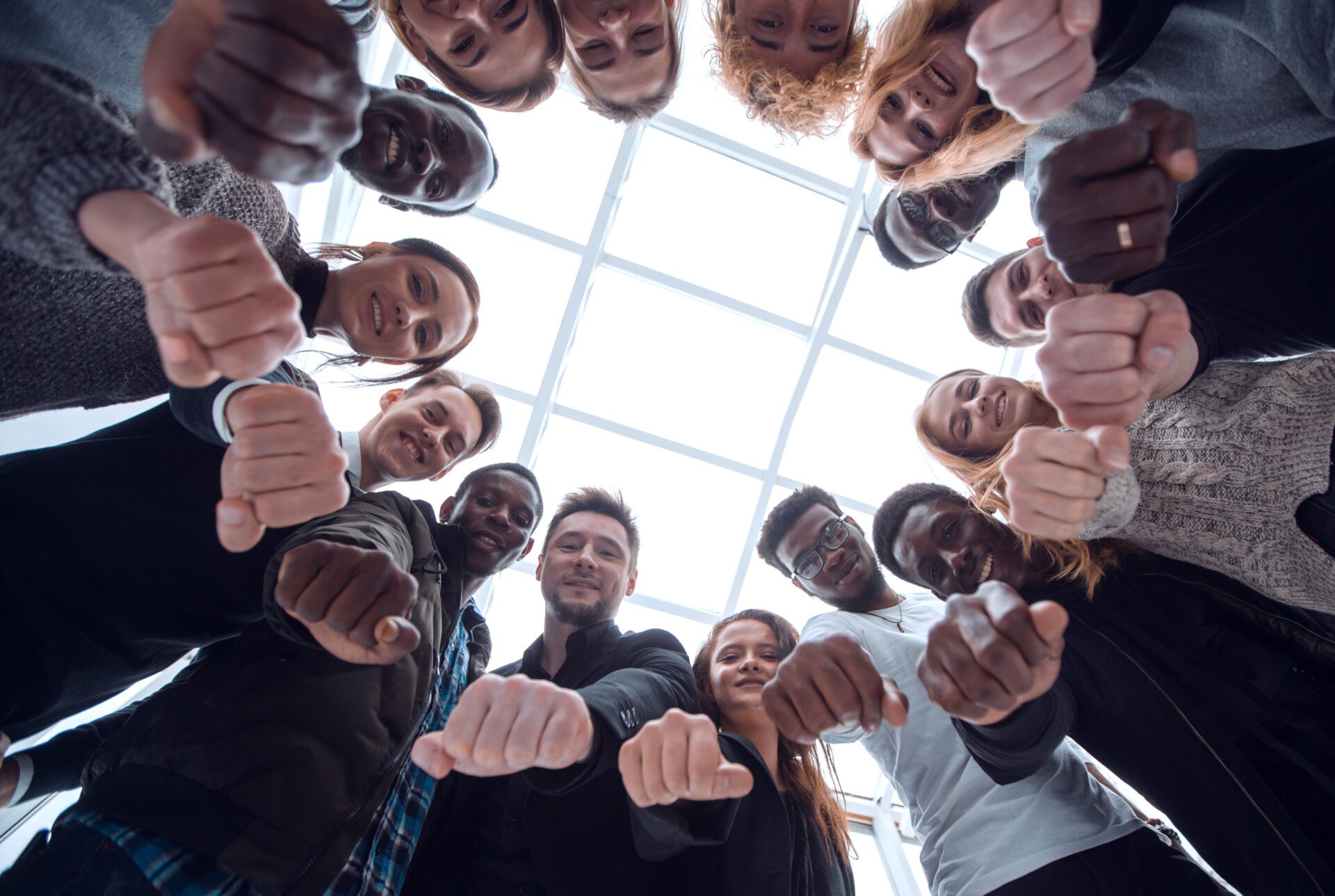 bottom view . group of diverse ambitious young people standing in a circle